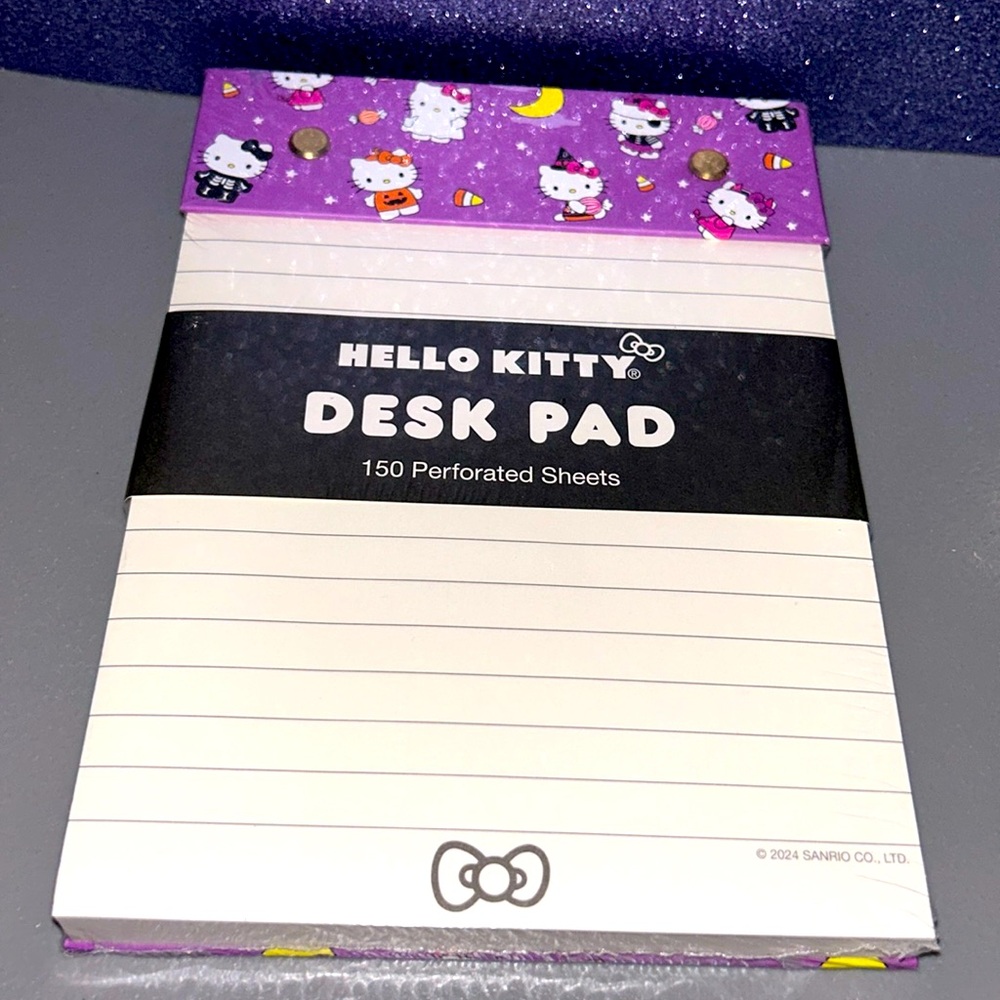 Hello Kitty in Halloween Costumes Desk Pad with perforated sheets